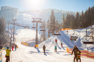 Bukovel, Ukraine - December 22, 2016: Skiers on the ski lift riding up at ski resort
